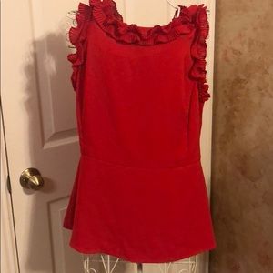 Women’s sleeveless blouse with ruffle accents